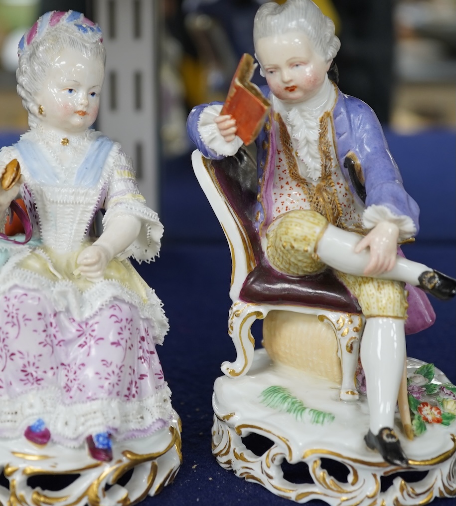 A pair of 19th century Meissen figures of a girl holding a shell and a boy holding a book, in size model number 628, tallest 13cm